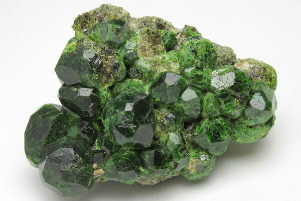An amazing cluster of dark-green demantoid garnets from Iran.